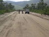 Discussing road conditions ahead. Overnight rain had made the rainforest section of the road quite muddy and some vehicles were turning back. We pressed on and had no problems.