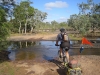 Ed crossing the Hann River. Nice fresh cooling water to drink and flop into. A good spot for camping too although we went on to Saltwater Creek.