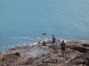 Ed and Mark wrestling their bikes the final metres to the northern Tip of Australia. Cape York. Australia.