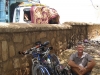 Downmarket Morocco, Ed squats outside the weekly souk(market) at Azrou