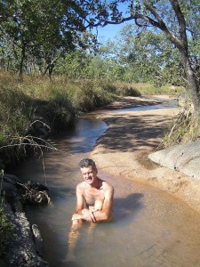 Ed relaxing in an offshoot of the Edith River