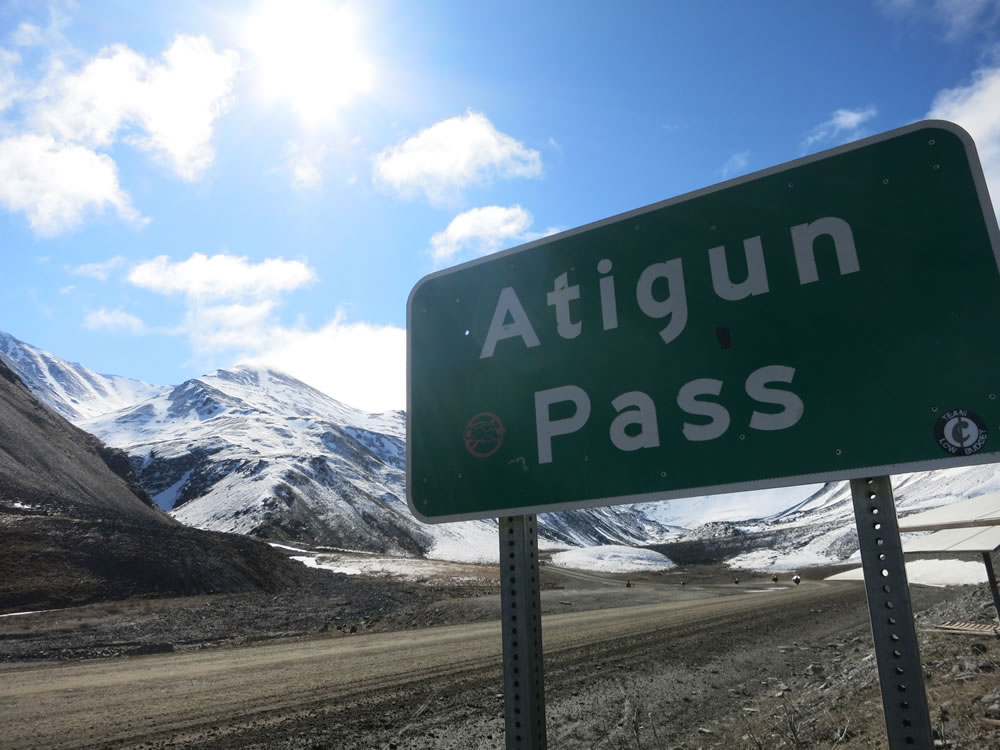 over the snowy slopes of Atigun Pass,