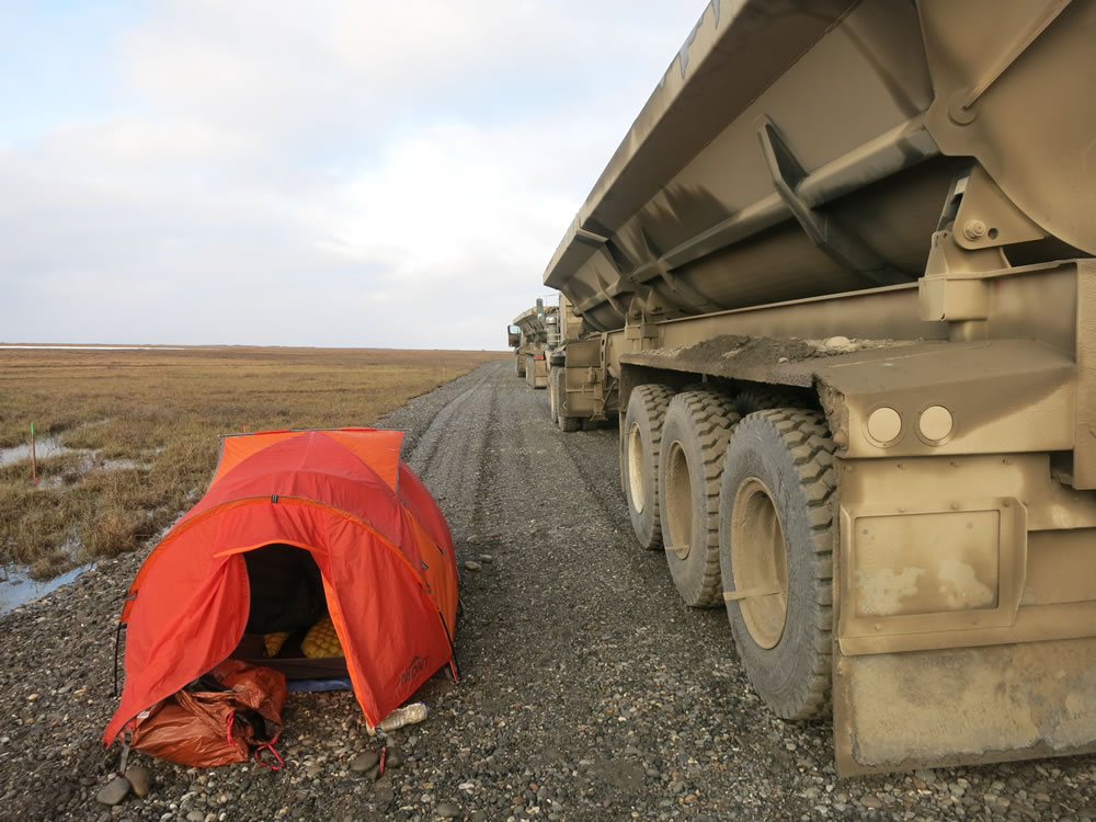 sheltering the last night alongside a lineup of huge road construction trucks parked for the night. 