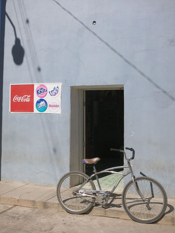 A small coke sign is often the only indication that a building is actually a shop